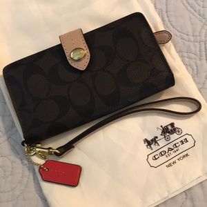Sold Coach Signature Canvas Wallet.